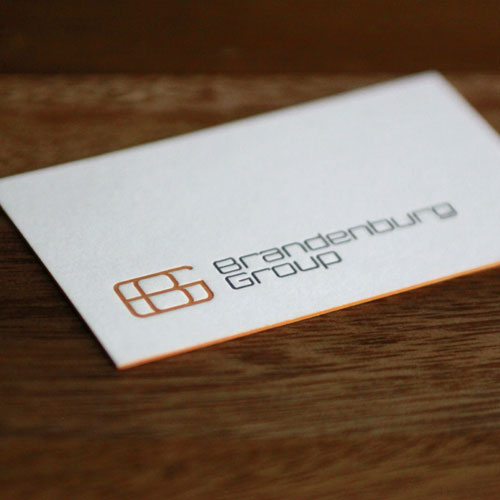Custom business card design letterpressed with edge painting for Brandenburg Group